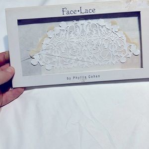 Adhesive white lace face mask. New in box never used.